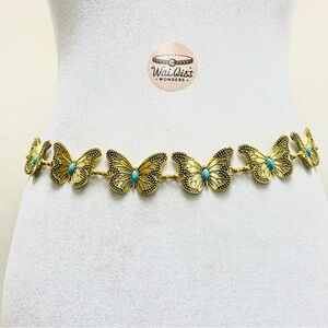 Gold butterfly belt with blue stone details